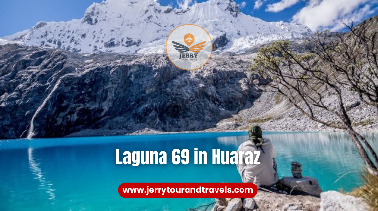 A stunning view of Laguna 69 in Huaraz, surrounded by snow-capped peaks and vibrant blue waters, a top destination for hiking in Peru.